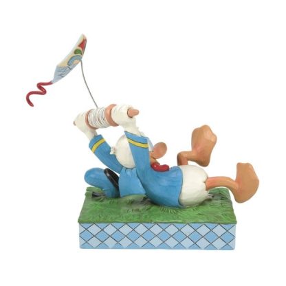 Donald Duck With Kite Figurine by Disney Traditions6014314A fun piece from Jim Shore as part of his Disney Traditions collection is this Donald Duck flying a kite figurine. jim shore pato donald disney
