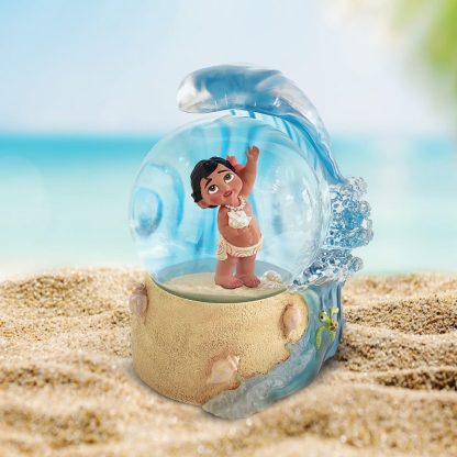 Baby Moana Waterball6016306Capture the magic of Disney's Moana with this enchanting Baby Moana Waterball. The beloved character is charmingly recreated in this beautiful piece, surrounded by a shimmering flurry of water that brings the seascape to life. This delightful keepsake is the perfect gift for Disney aficionados, capturing Moana's spirit of adventure and joy.